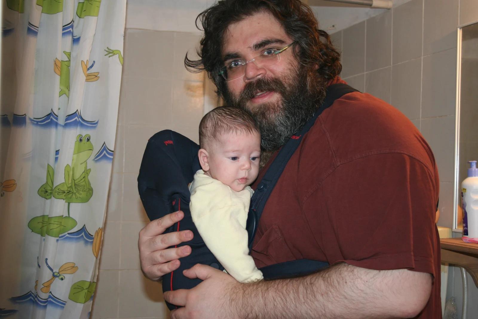 Nico as a baby, held by Dad