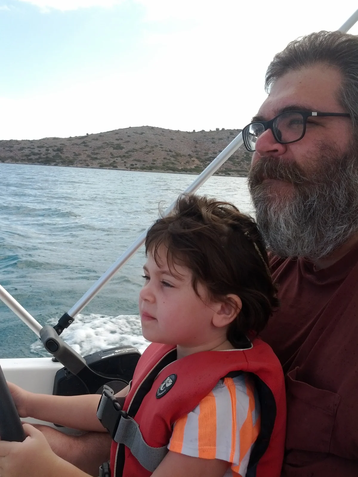 Nico and Dad together on a boat